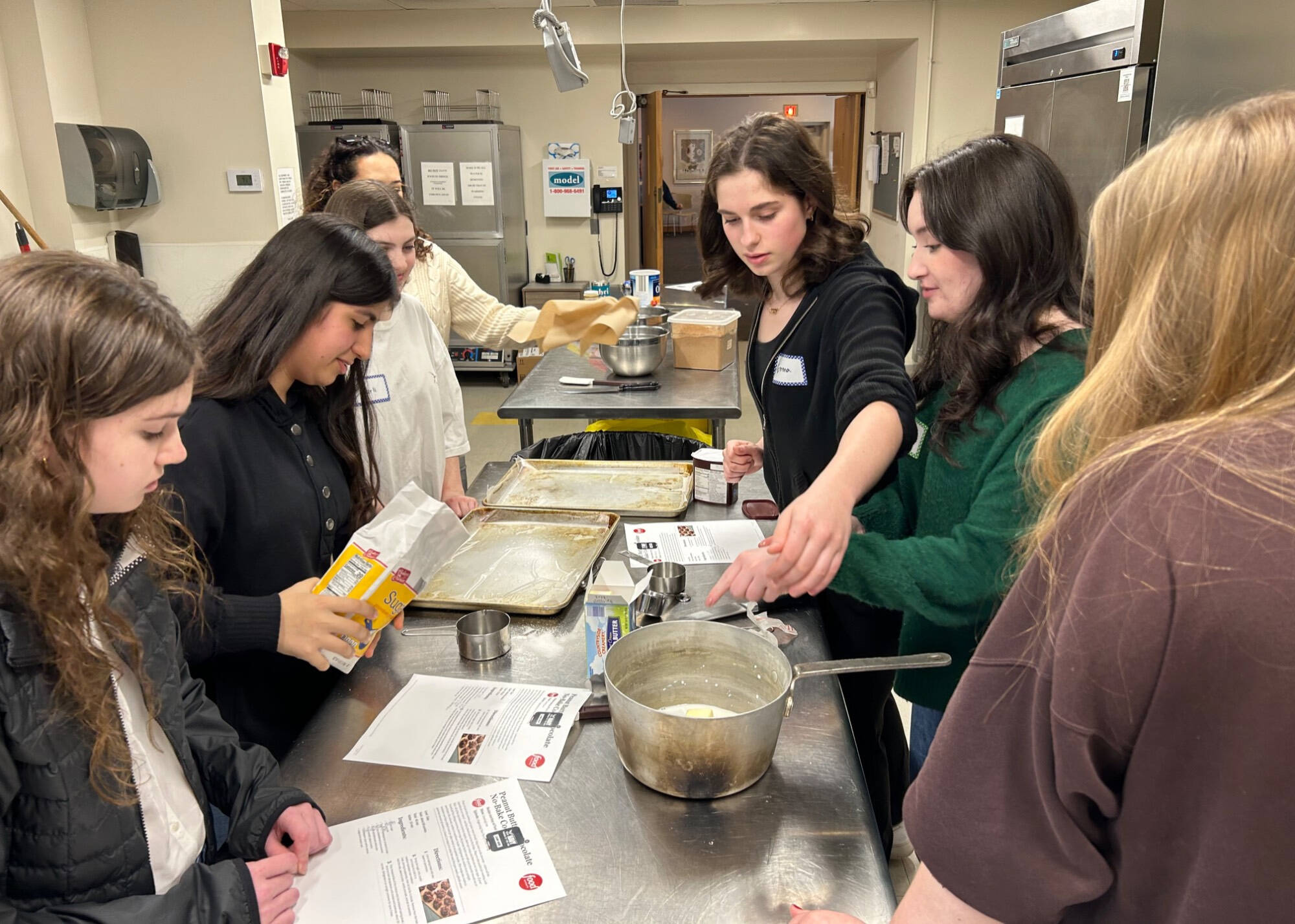 Scholars cooking together at an event